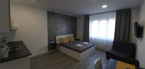 Postel nebo postele na pokoji v ubytování Apartmani Karlo