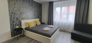 Postel nebo postele na pokoji v ubytování Apartmani Karlo