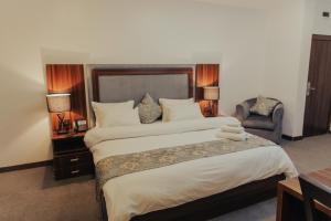A bed or beds in a room at Sinclair Lake Chad