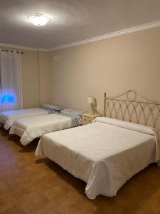 Postel nebo postele na pokoji v ubytování VILLA ZAMORA
