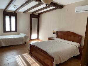 Postel nebo postele na pokoji v ubytování VILLA ZAMORA + 31 fotografií