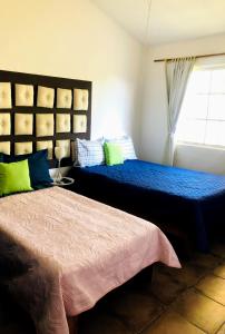 Katil atau katil-katil dalam bilik di Casa Angeles