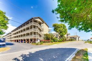 an apartment building on the side of a street at Spacious Modern Condo - 1st Floor - One Block to the Beach in Myrtle Beach