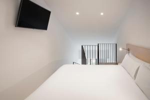 Posteľ alebo postele v izbe v ubytovaní B&B HOTEL Málaga Centro