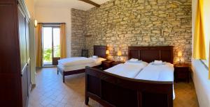 A bed or beds in a room at Buchere Ville