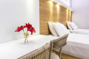 Postel nebo postele na pokoji v ubytování Hotel Costamar Ponta Verde