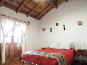 Voodi või voodid majutusasutuse Picaflor Tambo Guest House toas