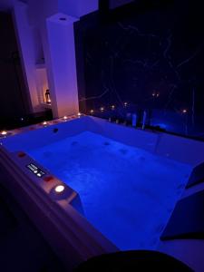 a swimming pool at night with a remote control at Real suite spa in Palermo