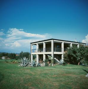 a large white building with a large yard at Bed & Breakfast IL PAJO in Padenghe sul Garda