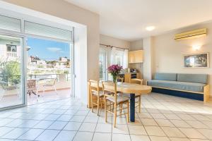 a living room with a table and a couch at Anna Αpartments II in Agia Marina Nea Kydonias