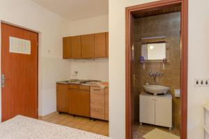 a small kitchen with a sink and a sink at Apartmani Srdjana in Prizba +111 photos
