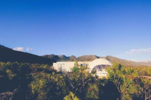a white house in the middle of a mountain at Starry Starry Night in Montagu