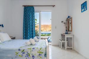Postel nebo postele na pokoji v ubytování Antoniadi Rooms