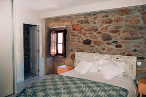 Łóżko lub łóżka w pokoju w obiekcie A Casa Alegre