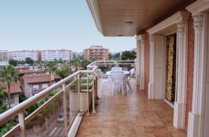 a patio area with a walkway and a balcony at Apartamentos Imperial in Salou