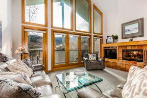 a living room with two couches and a fireplace at Fawngrove #1676 in Park City