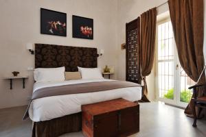 Łóżko lub łóżka w pokoju w obiekcie Hotel Boutique V