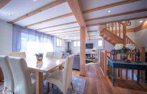 a dining room with a wooden table and chairs at Beautiful 3 Bedroom Chalet in Morzine in Morzine