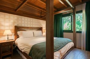 Cama ou camas em um quarto em Hotel Fioreze Chalés