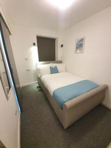 a bedroom with a large bed in a room at Alexandra Hotel Blackpool in Blackpool