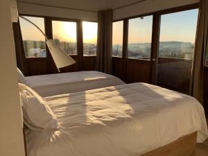 A bed or beds in a room at Rectoral de Boente
