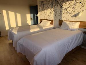 A bed or beds in a room at Rectoral de Boente