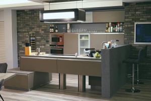 a kitchen with a large counter with a sink at Loft mit Whirlpool Sauna Kino nähe Wolfsburg in Helmstedt