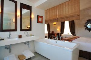 Łóżko lub łóżka w pokoju w obiekcie Hotel Boutique V