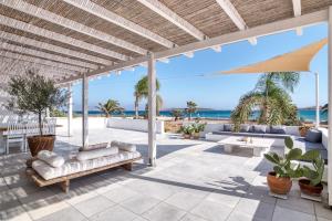 an outdoor patio with couches and a view of the ocean at The view 1 in Kampos Paros