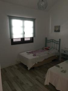Postel nebo postele na pokoji v ubytování Casa Norah Pc