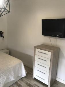 TV a/nebo společenská místnost v ubytování Casa Norah Pc