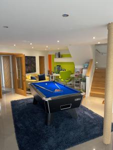 a living room with a pool table in it at Meadow End in Tavistock
