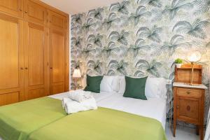 En eller flere senge i et værelse på MONKÓ LAS PALMERAS + 25 billeder