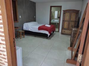 מיטה או מיטות בחדר ב-Pousada Portas da Lua