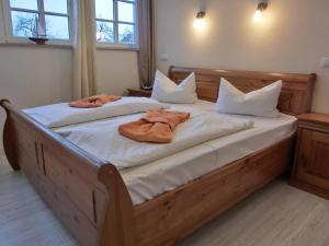 a bedroom with two beds with towels on them at Ferienhaus FH17b in Graal-Müritz +9 photos