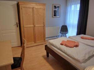 Ένα ή περισσότερα κρεβάτια σε δωμάτιο στο Ferienwohnung F1