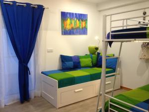 Postel nebo postele na pokoji v ubytování Blue House