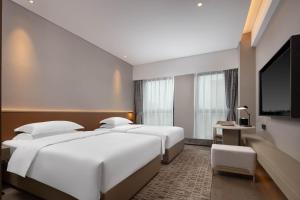 TV a/nebo společenská místnost v ubytování Leeden Hotel Hangzhou