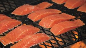 a bunch of salmon cooking on a grill at Thunder Mountain Place - Quiet, Comfortable Place Offering DISCOUNT ON TOURS! in Juneau