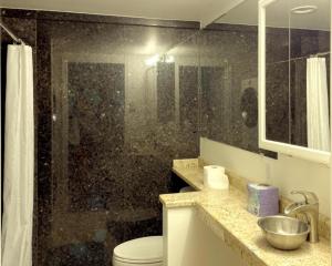a bathroom with a shower with a toilet and a sink at Suite Rock near glacier and Auke Bay harbor -DISCOUNTS ON TOURS! in Mendenhaven +18 photos