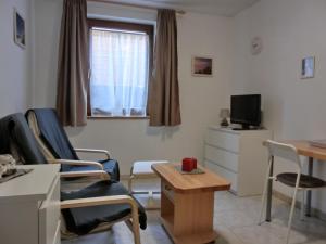 TV a/nebo společenská místnost v ubytování Ferienwohnung R22