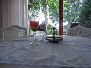 a table with a wine glass on top of it at Ferienwohnung NH6 in Hirschburg +9 photos