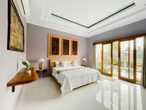 Katil atau katil-katil dalam bilik di Villa D'alas Ubud