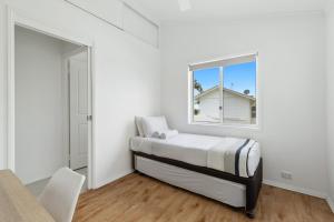 Ein Bett oder Betten in einem Zimmer der Unterkunft Lazy Days by Stay Noosa