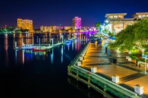 a city skyline at night with a river and buildings at LUXURIOUS COZY STUDIO. in Tampa