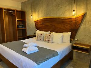 a hotel room with a bed and a desk at Little Gem Hotel Tulum La Veleta in Tulum