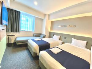 hotel MONday Premium Ueno Okachimachi房間的床