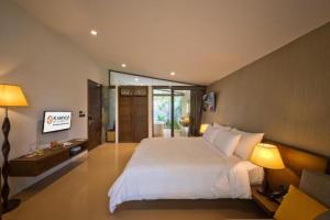 Giường trong phòng chung tại FLAMINGO DAI LAI RESORT - luxury