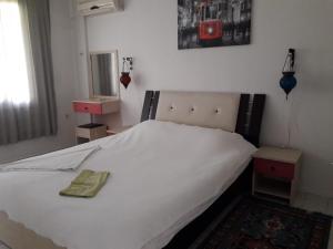 Tempat tidur dalam kamar di ASIA APART HOTEL