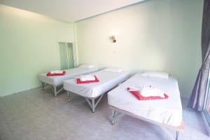 Katil atau katil-katil dalam bilik di Best House Resort